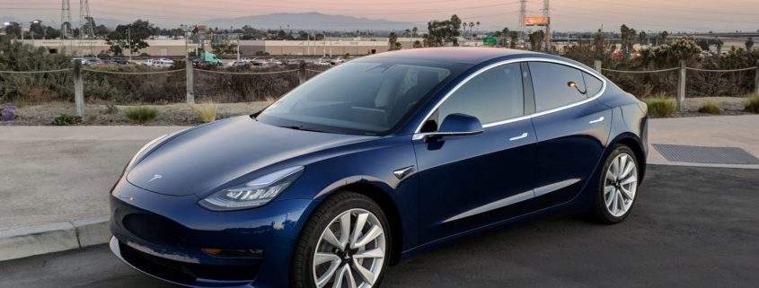 tesla slashes prices